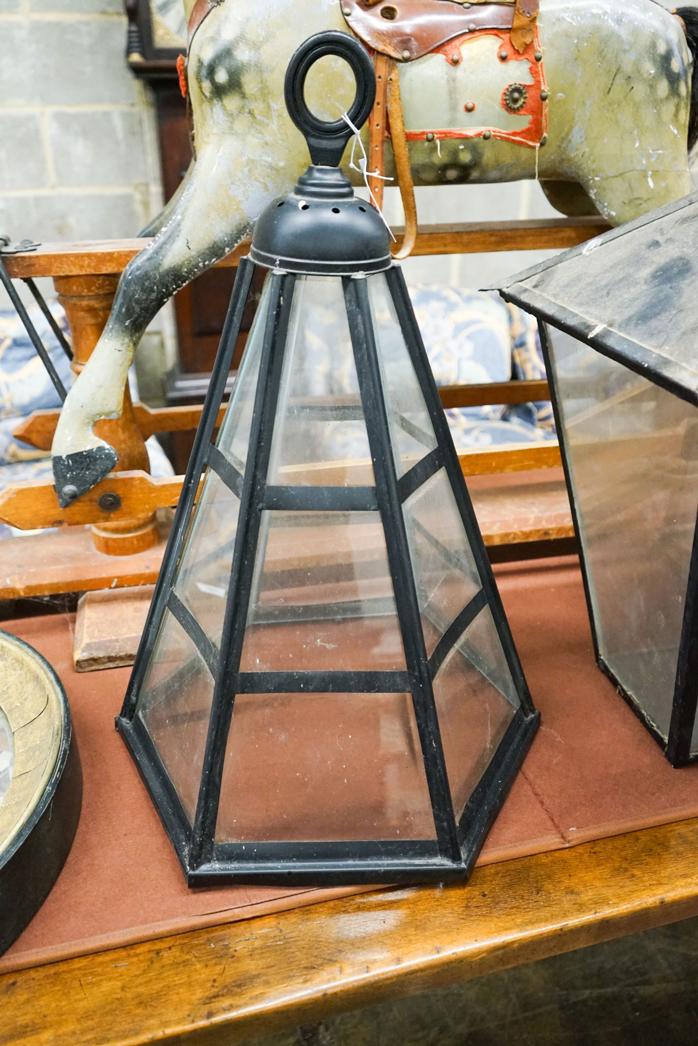 A pair of Victorian style black metal square lanterns, height 68cm together with one other and a reproduction convex wall mirror